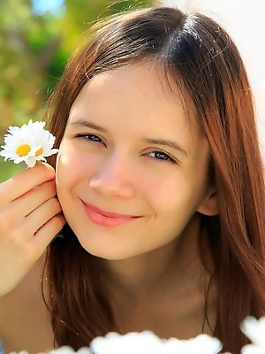 Eiby Shine flaunts her sweet naturals and tigh ass in front of the camera.